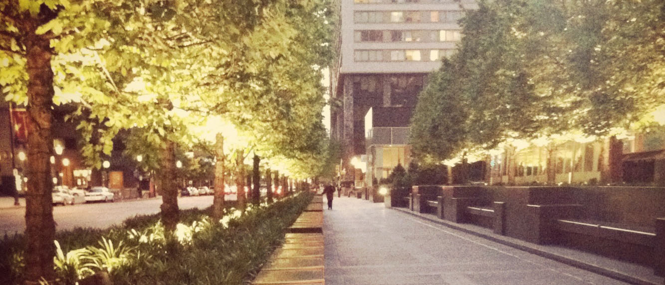 a philadelphia sidewalk in the summer at dusk